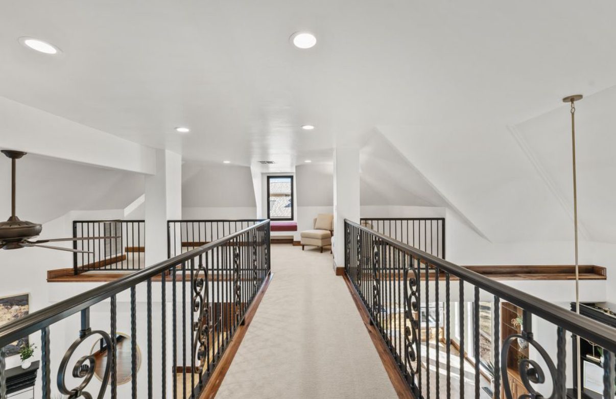 Upper hallway with wrought iron railings