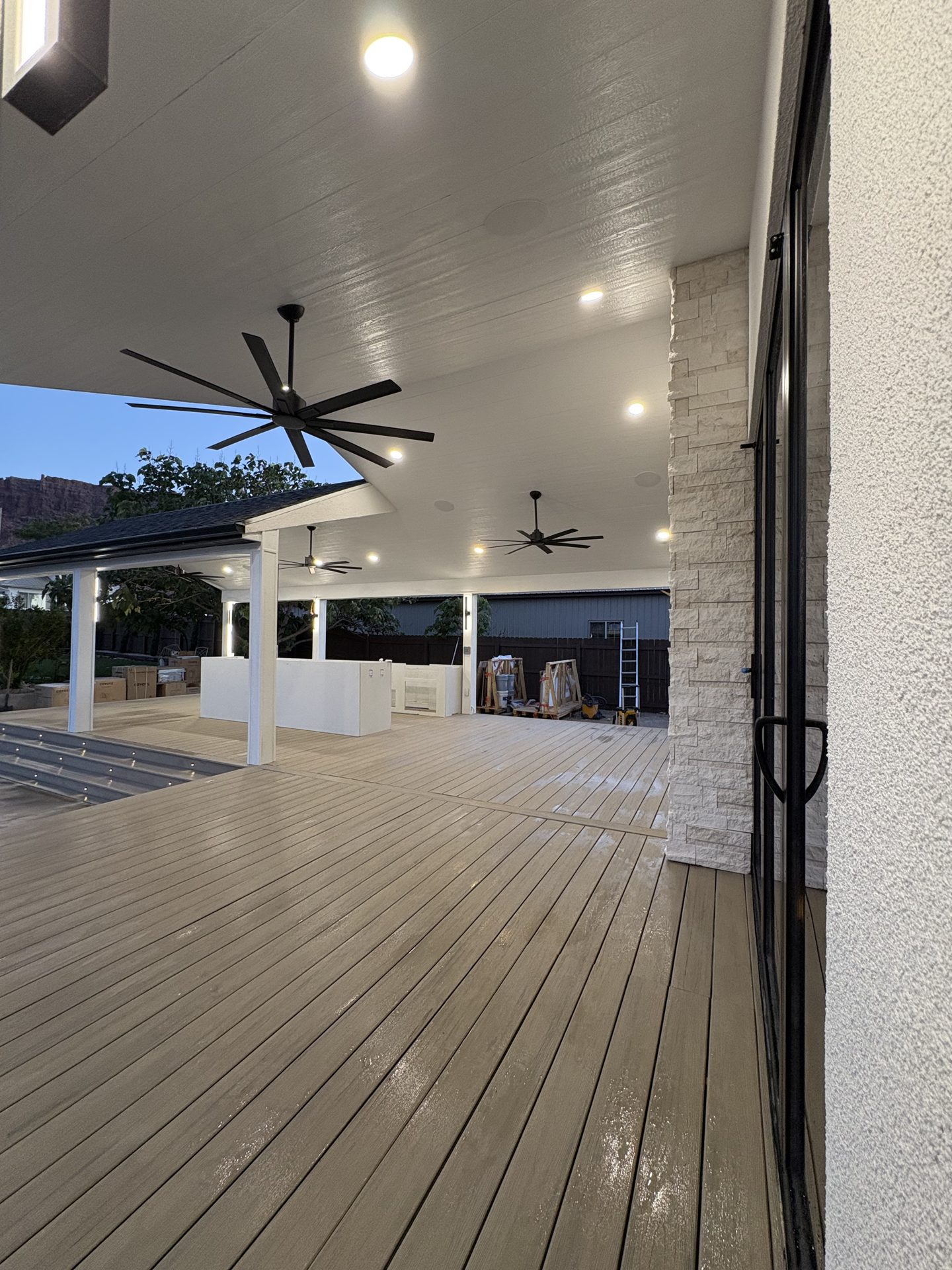 Large covered patio with ceiling fans